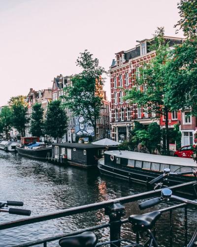 Classic Amsterdam canal view with traditional Dutch houses and boats