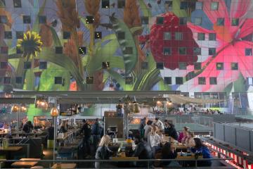 a group of people sitting at a table in a restaurant
